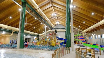 Enjoy the thrill of our indoor water park with water slides and a wave pool, surrounded by comfortable seating.