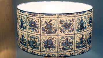 A lamp with a blue and white patterned design.