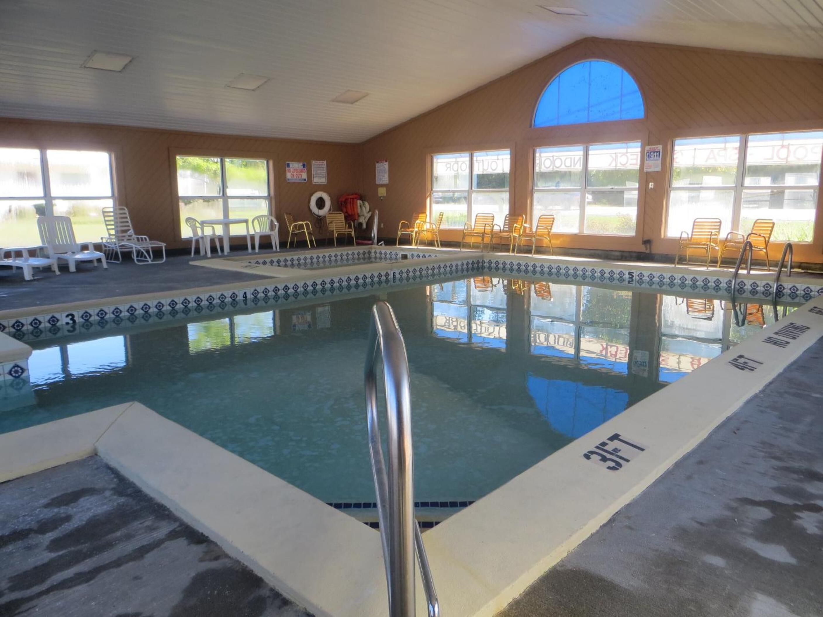 Seasonal outdoor pool, open 10:00 AM to 11:00 PM, pool umbrellas