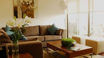 Superior Apartment (Up to 4) | Living room | 32-inch LCD TV with cable channels, TV