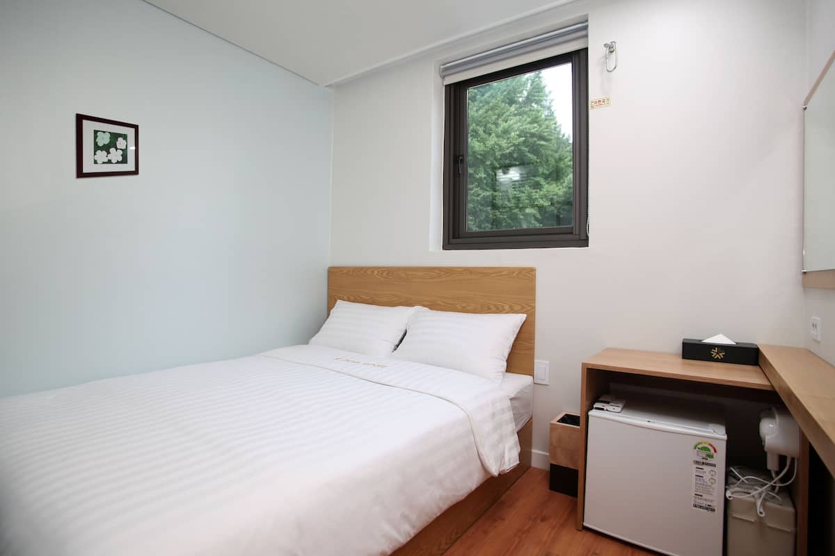 Premium bedding, down duvets, blackout curtains, soundproofing