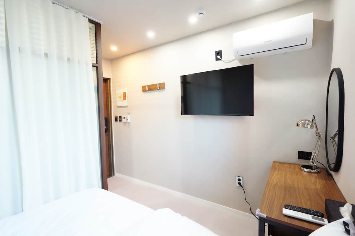 Premium bedding, down duvets, blackout curtains, soundproofing