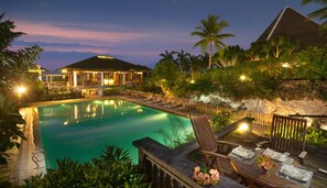 Outdoor pool, an infinity pool, pool loungers