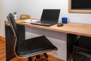 Premium bedding, desk, laptop workspace, iron/ironing board