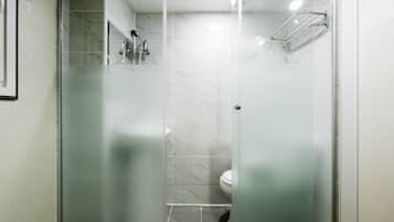 Shower, hair dryer, slippers, towels