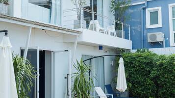 Outdoor pool, open 7:00 AM to 10:00 AM, pool umbrellas, pool loungers