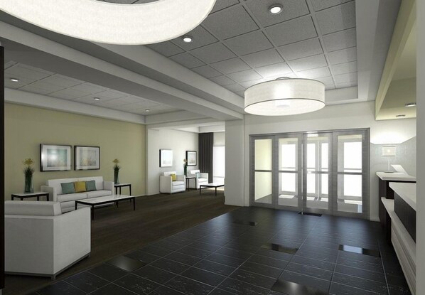 A spacious lobby with a modern design, featuring a large seating area, a reception desk, and a large window providing natural light. - Holiday Inn Express & Suites Thunder Bay by IHG (Thunder Bay)