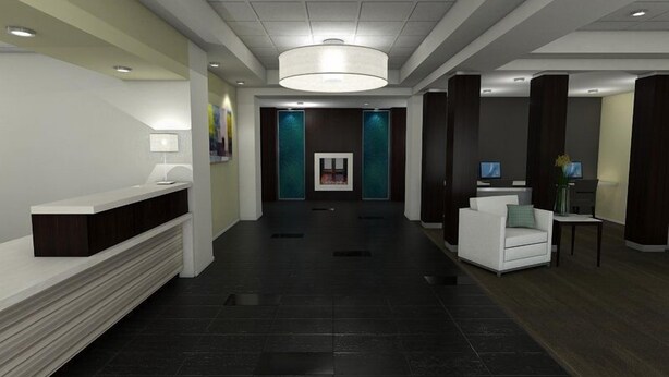 A modern lobby with a reception desk, seating area, and a large chandelier. - Holiday Inn Express & Suites Thunder Bay by IHG (Thunder Bay)