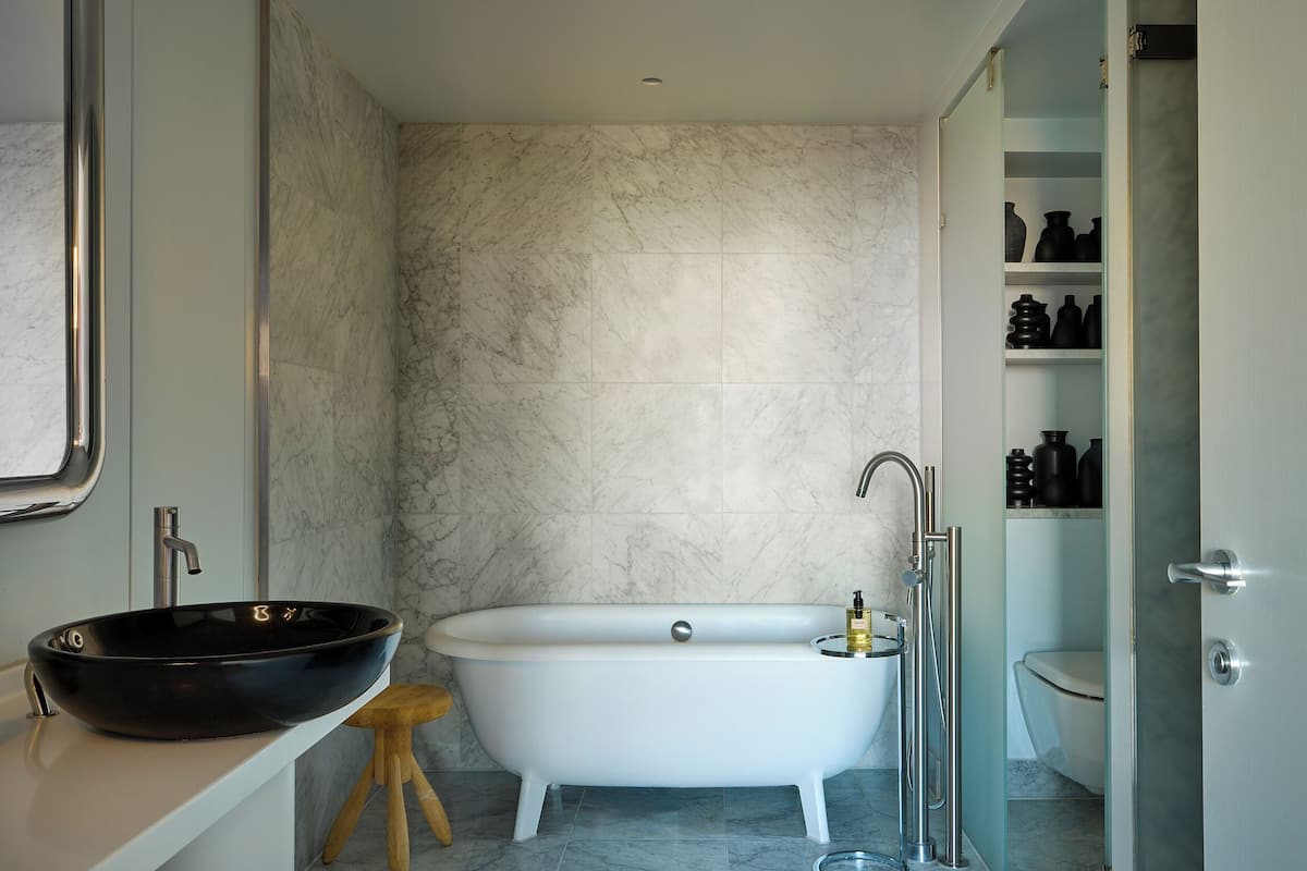 Designer toiletries, hair dryer, bathrobes, slippers