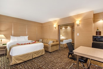 Studio Suite, 1 Bedroom (1 King and 1 Queen Bed) | In-room safe, desk, iron/ironing board, free cribs/infant beds at Ocean Beach Palace Hotel and Suites