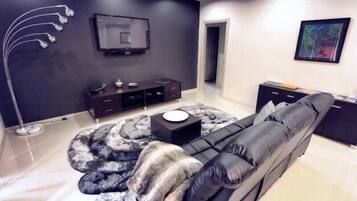 Deluxe Villa, 4 Bedrooms (Chardonnay) | Living room | Flat-screen TV, DVD player, iPod dock