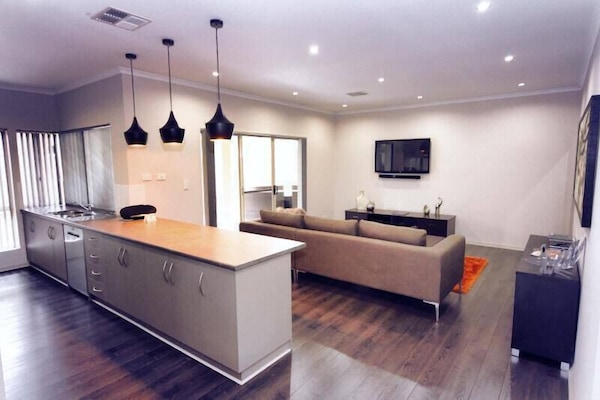 Deluxe Villa, 4 Bedrooms (Merlot) | Living area | Flat-screen TV, DVD player, iPod dock