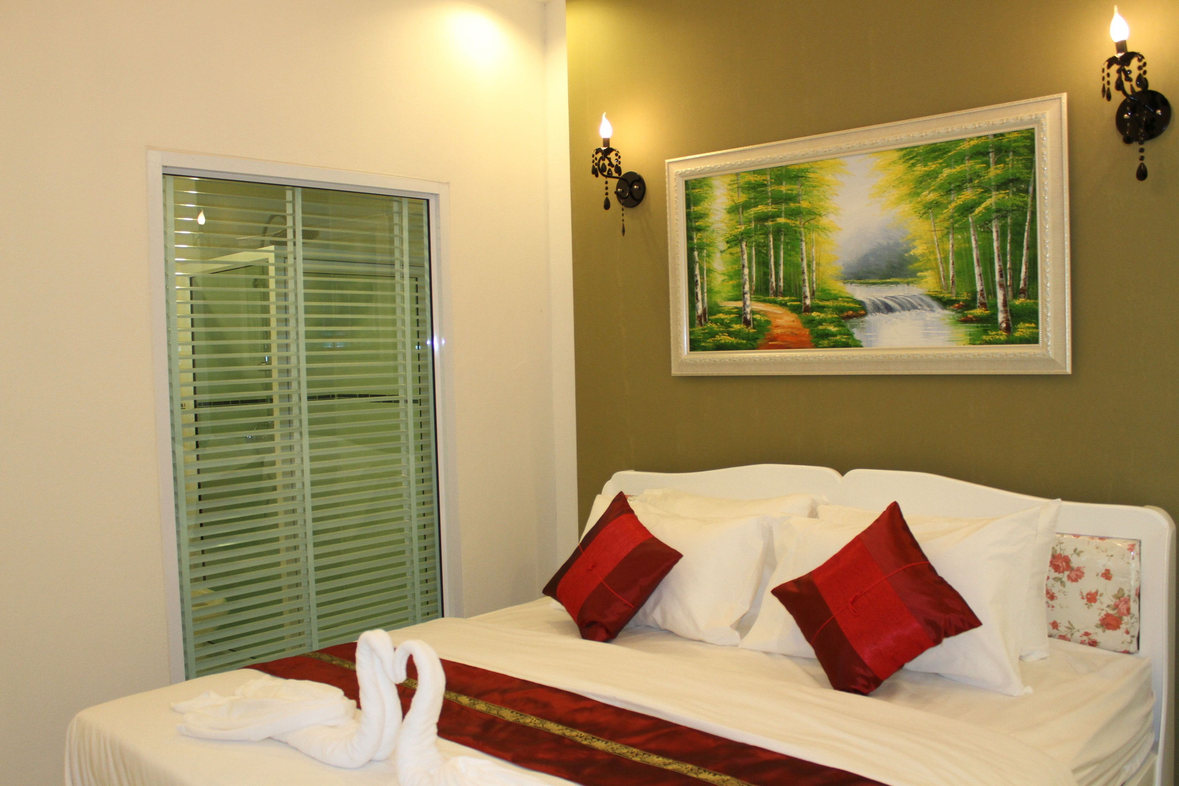 premium bedding, desk, laptop workspace, rollaway beds