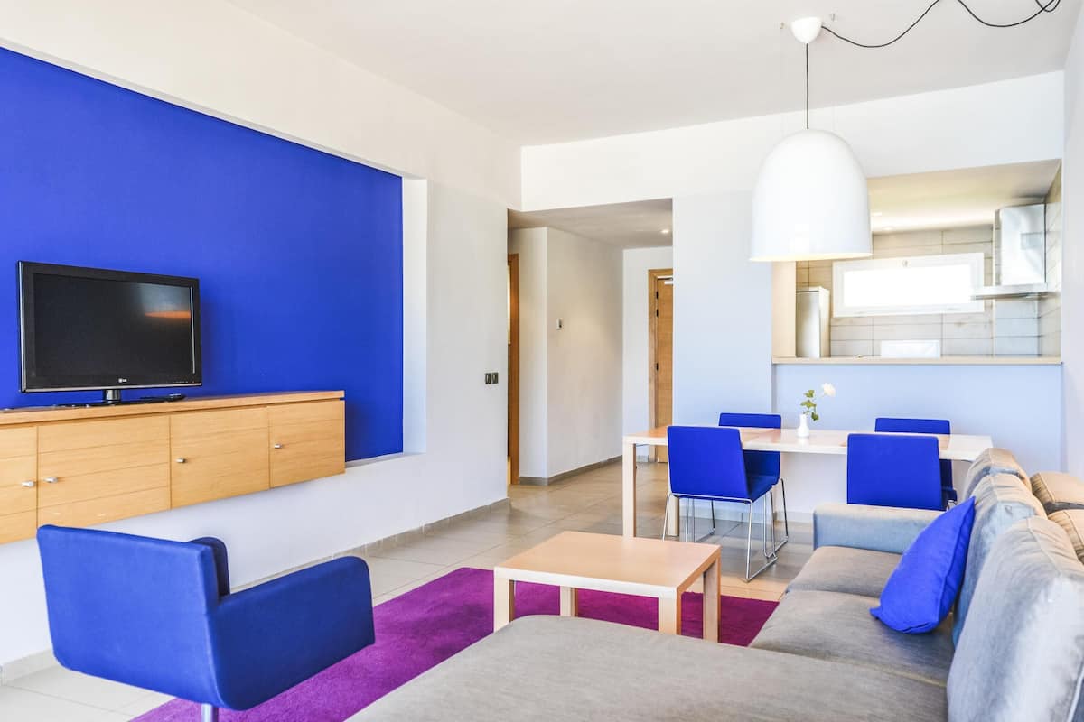 Apartment, 1 Bedroom, Balcony, Sea View | 1 bedroom, in-room safe, desk, blackout drapes