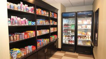 A vending area with snack and drink options, including a variety of packaged foods and beverages.