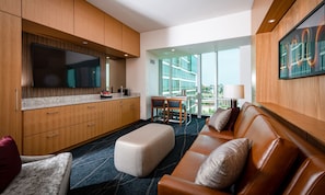 Superior Suite | Living room | 42-inch flat-screen TV with cable channels, TV, iPod dock