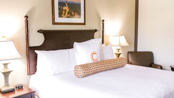 Premium bedding, desk, laptop workspace, blackout drapes