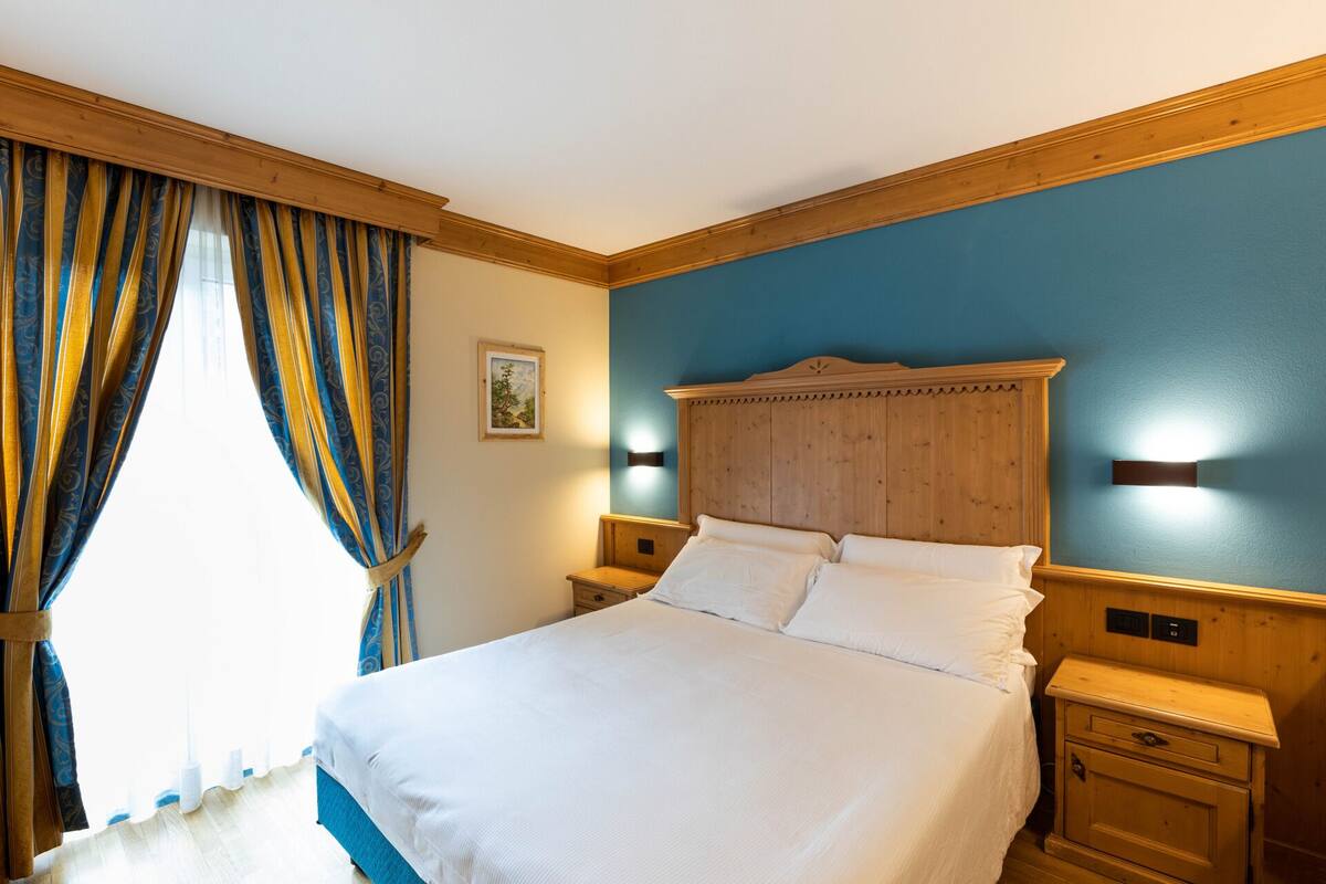 Habitación cuádruple Confort | Ropa de cama hipoalergénica y minibar