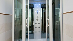 A modern elevator with a control panel and a glass enclosure. - Lh Royal Suites (Rome)