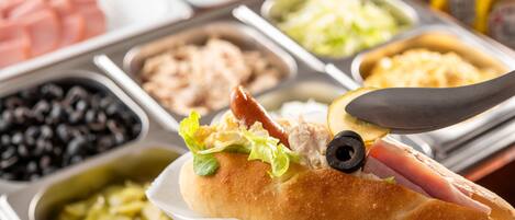 A sandwich with various toppings on a tray.