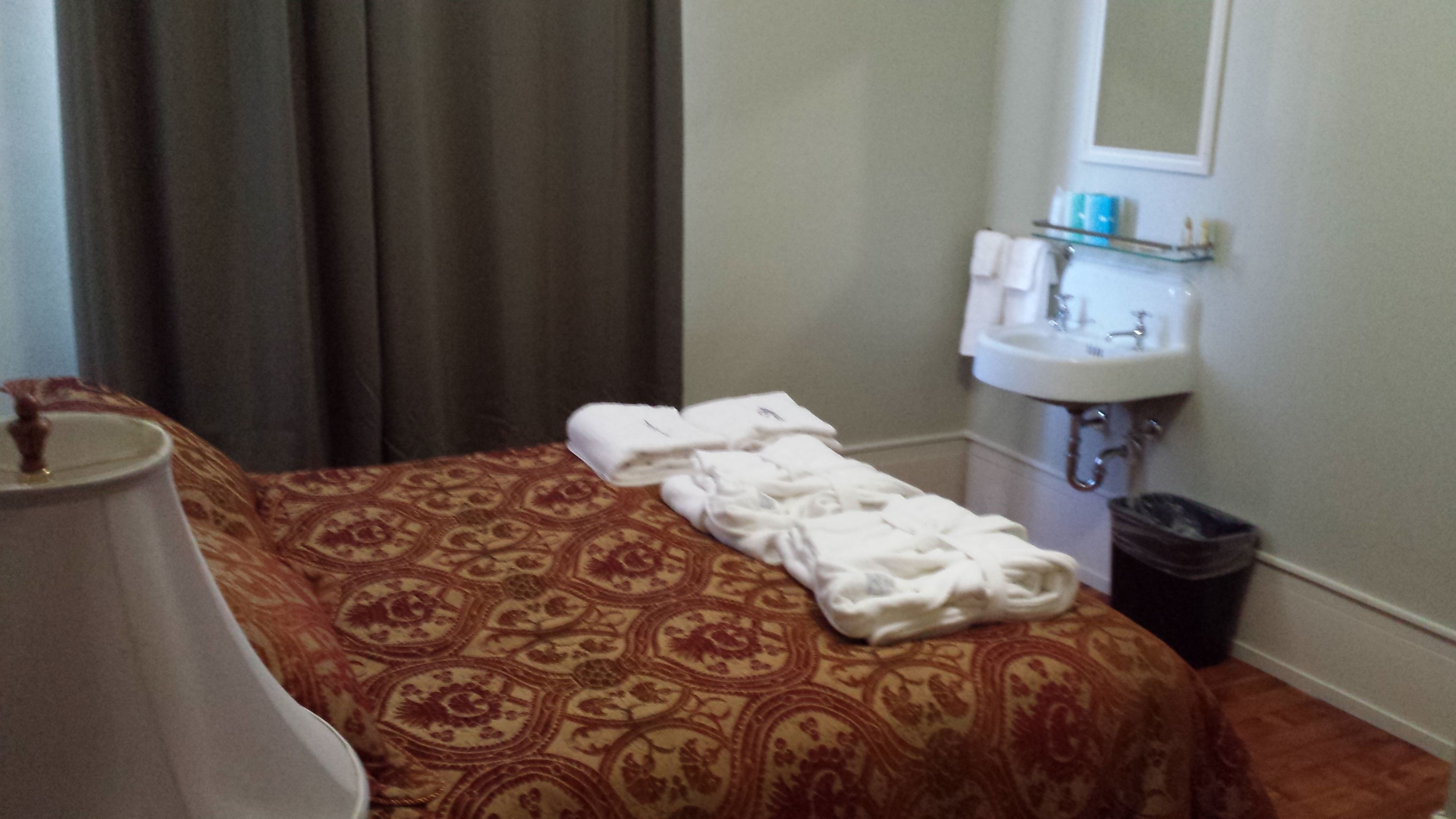 room (one queen bed, shared bath) | premium bedding, individually decorated, individually furnished