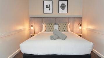 Desk, blackout drapes, iron/ironing board, cribs/infant beds