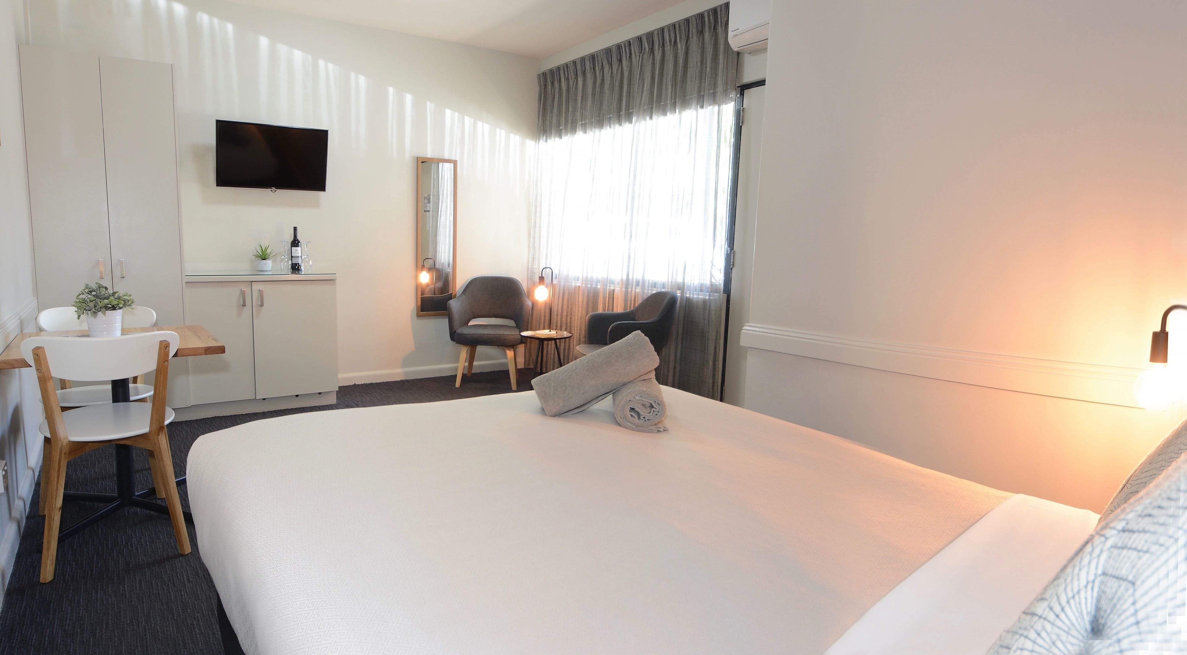 Executive Queen | Desk, blackout curtains, iron/ironing board, cots/infant beds