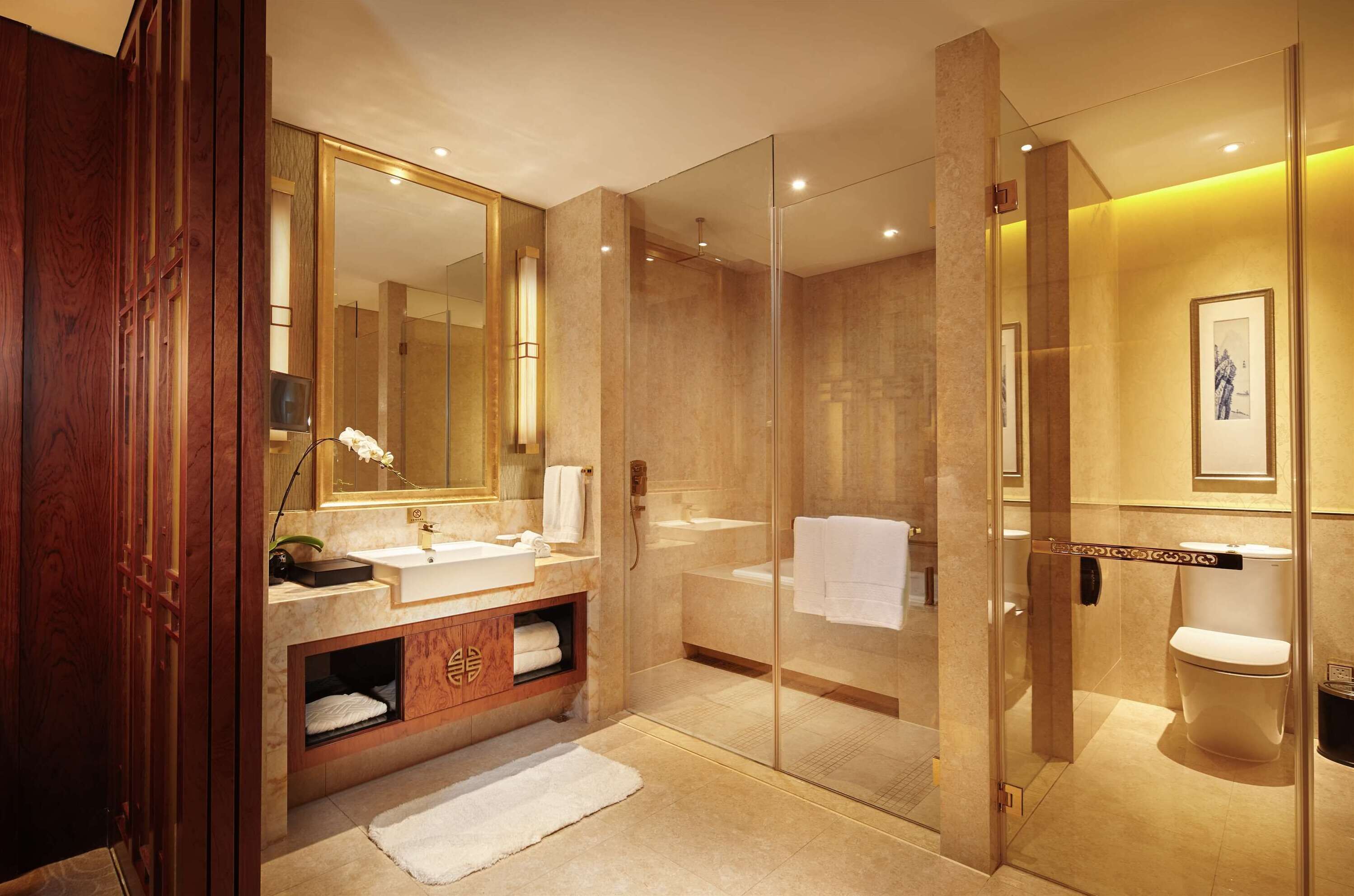 suite, 1 king bed | bathroom | separate bathtub and shower, rainfall showerhead, designer toiletries