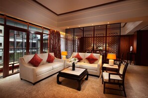 Luxury Suite, 1 King Bed (Ambassador) | Living area | 42-inch flat-screen TV with cable channels, TV, iPod dock