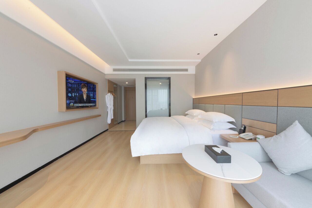 comfort twin room | premium bedding, down duvets, desk, laptop workspace