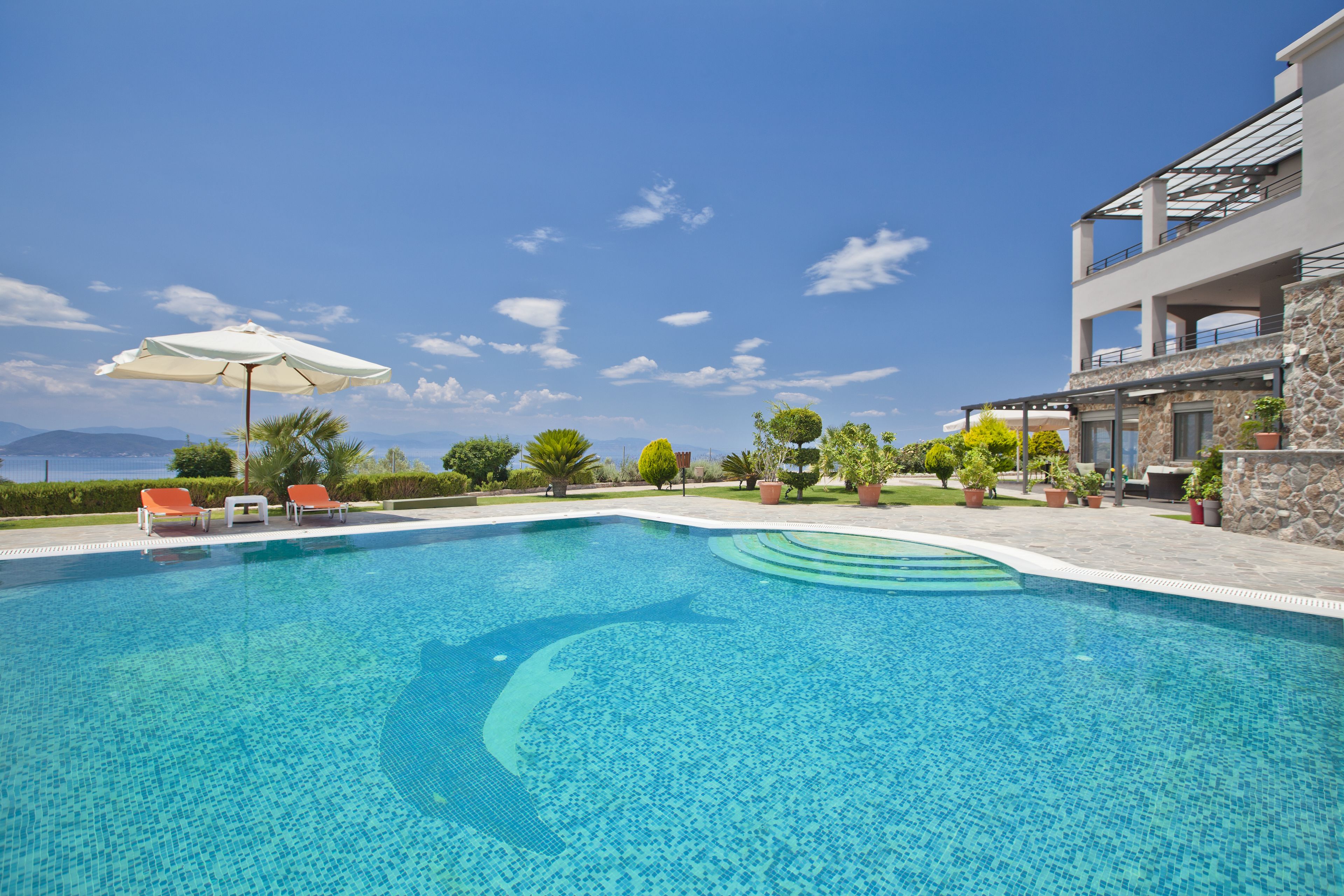 Seasonal outdoor pool, pool umbrellas, pool loungers