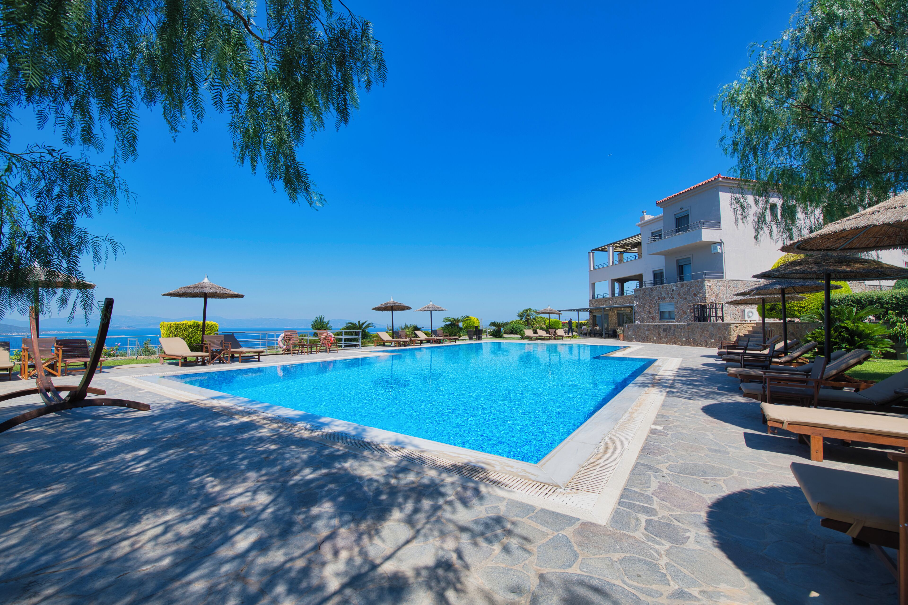 seasonal outdoor pool, pool umbrellas, pool loungers