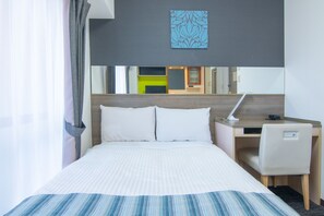 A hotel room with a bed, a desk, a chair, and a mirror. - Hotel MyStays Ueno Inaricho (Tokyo)