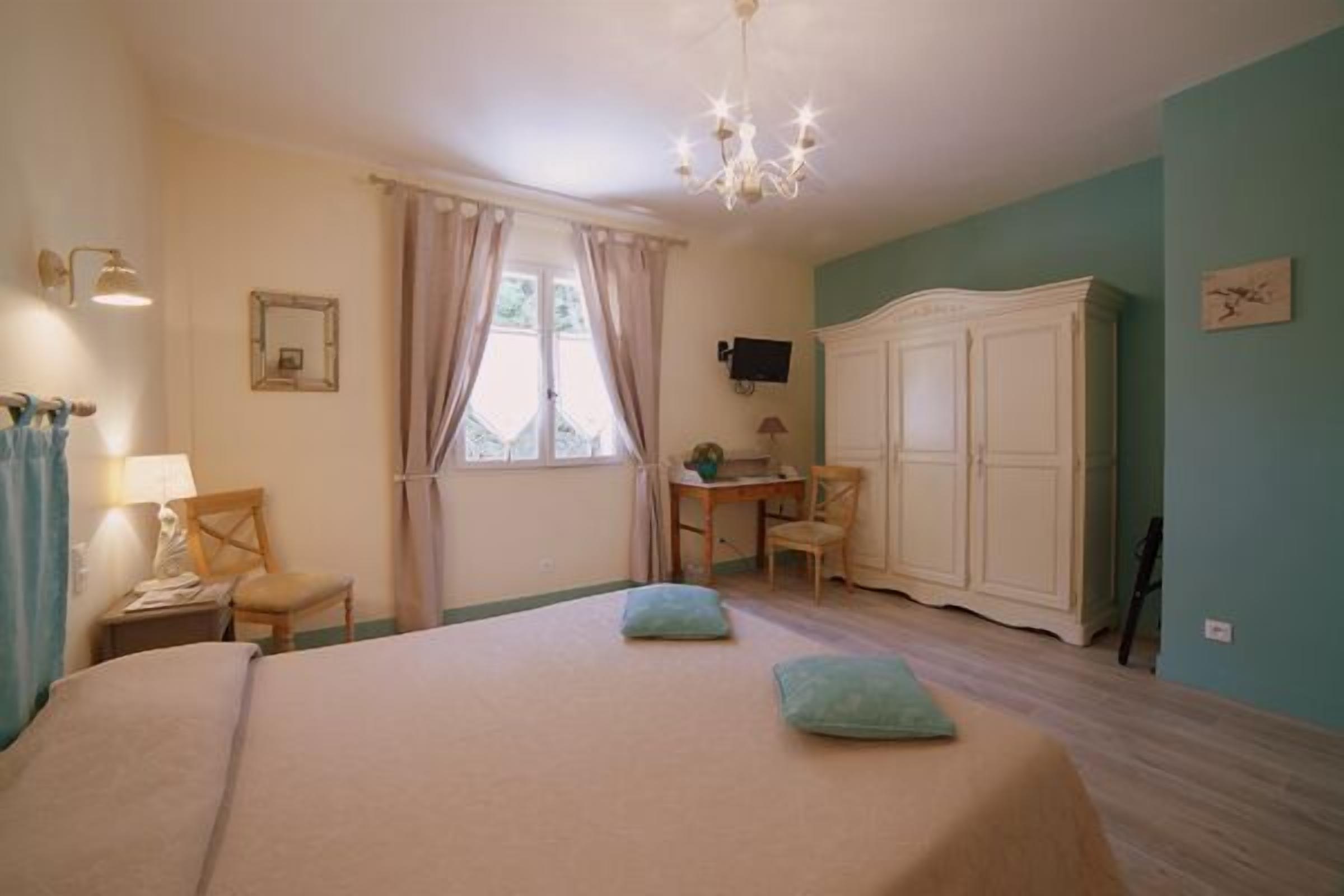 deluxe room (ground floor) | in-room safe, individually decorated, desk, blackout curtains