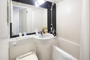 Combined shower/tub, free toiletries, hair dryer, slippers