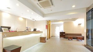 A spacious lobby with a reception desk, seating area, and a clear view of the entrance. - Hotel MyStays Kamata (Tokyo)