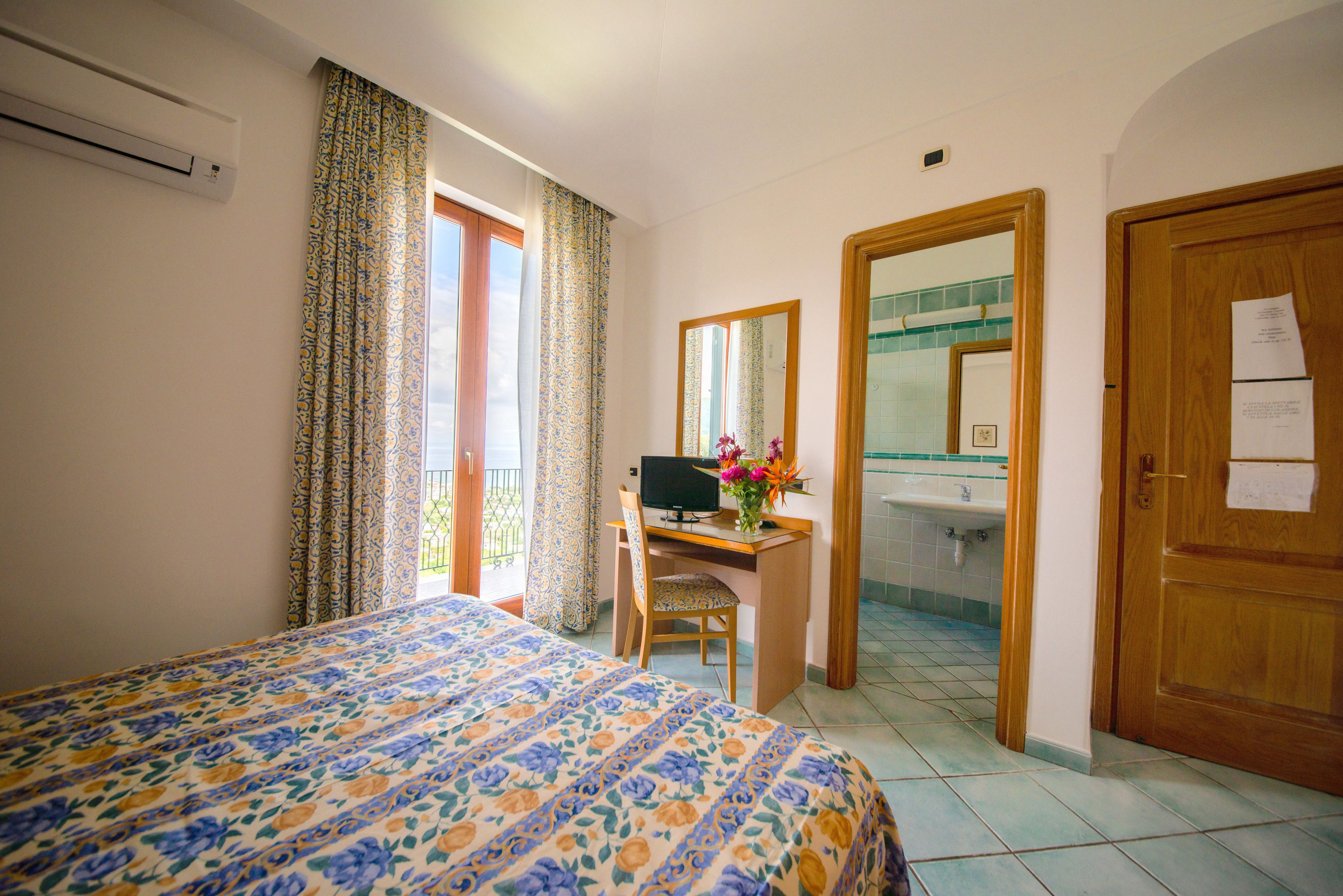 Standard Double Room | Minibar, in-room safe, desk, cots/infant beds