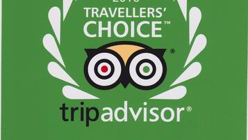 A logo with the text "2016 TRAVELLERS' CHOICE™ WINNER" and "tripadvisor®".