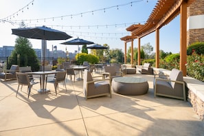 Outdoor pool, open 7 AM to 10 PM, pool umbrellas, sun loungers