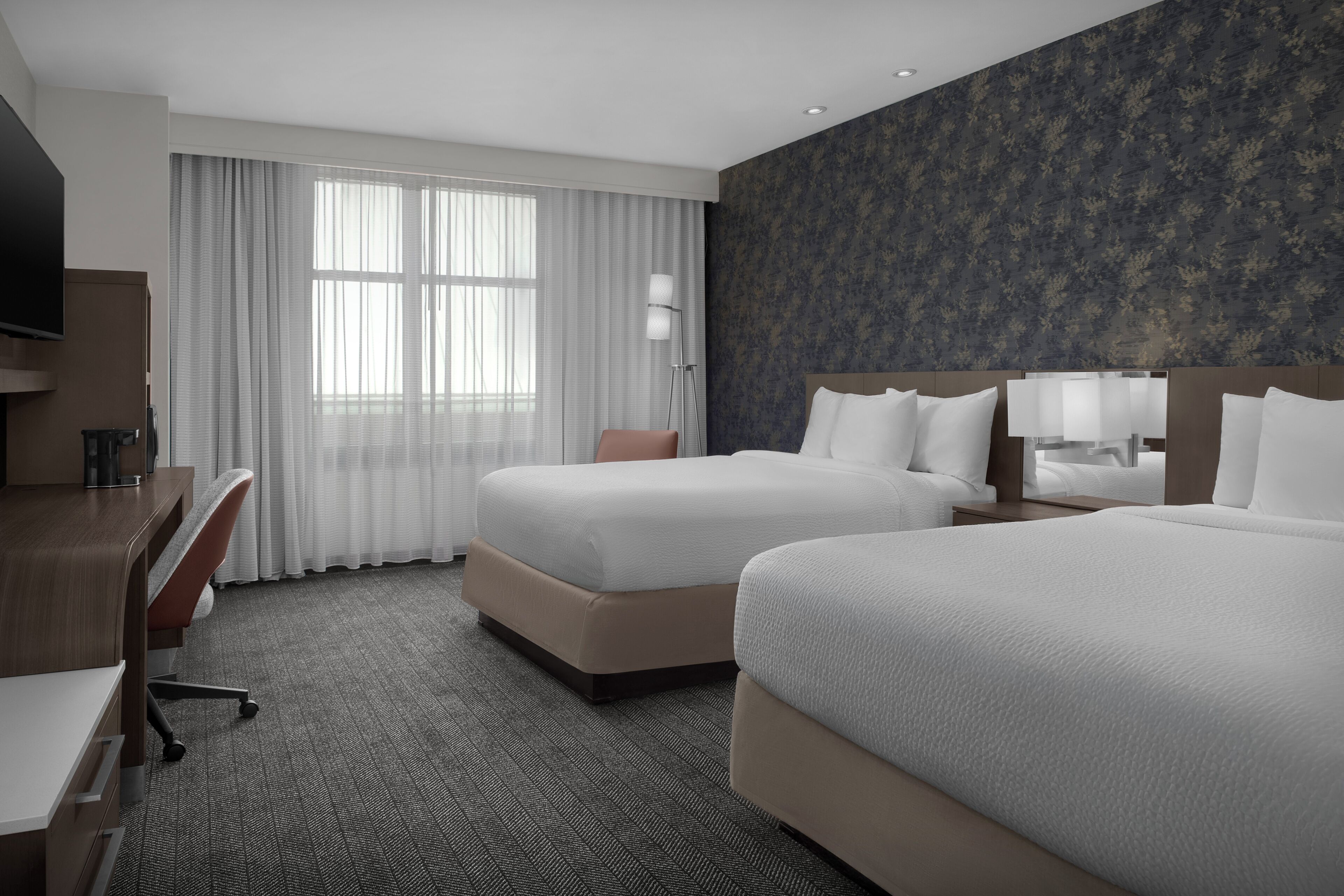 Premium bedding, pillowtop beds, desk, laptop workspace