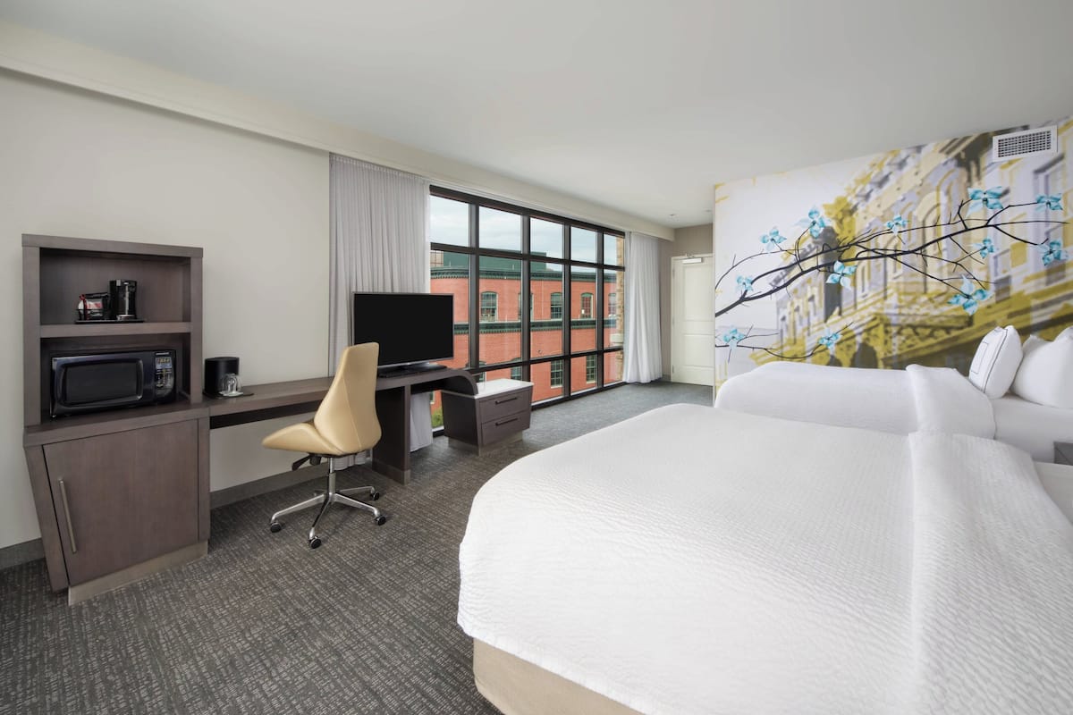 Premium bedding, pillow-top beds, desk, laptop workspace