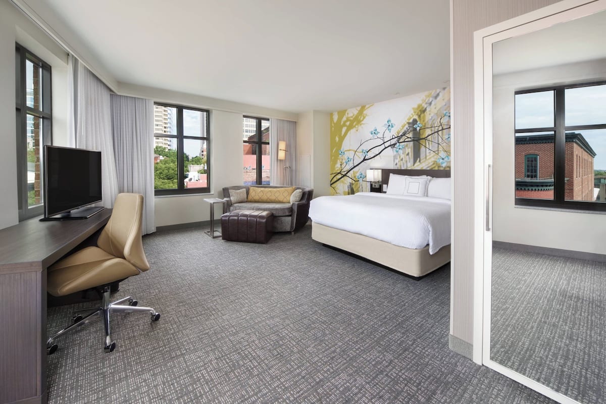 Premium bedding, pillow-top beds, desk, laptop workspace