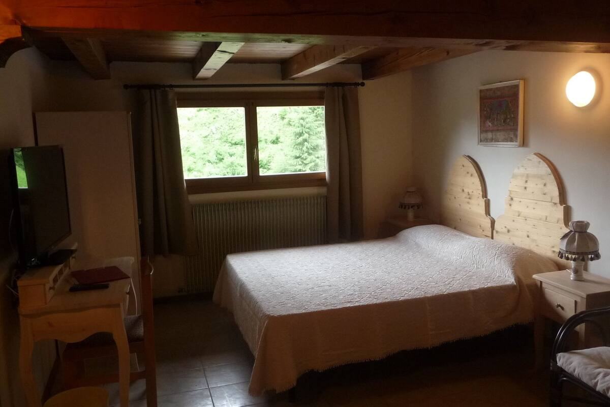 Down duvets, desk, laptop workspace, bed sheets