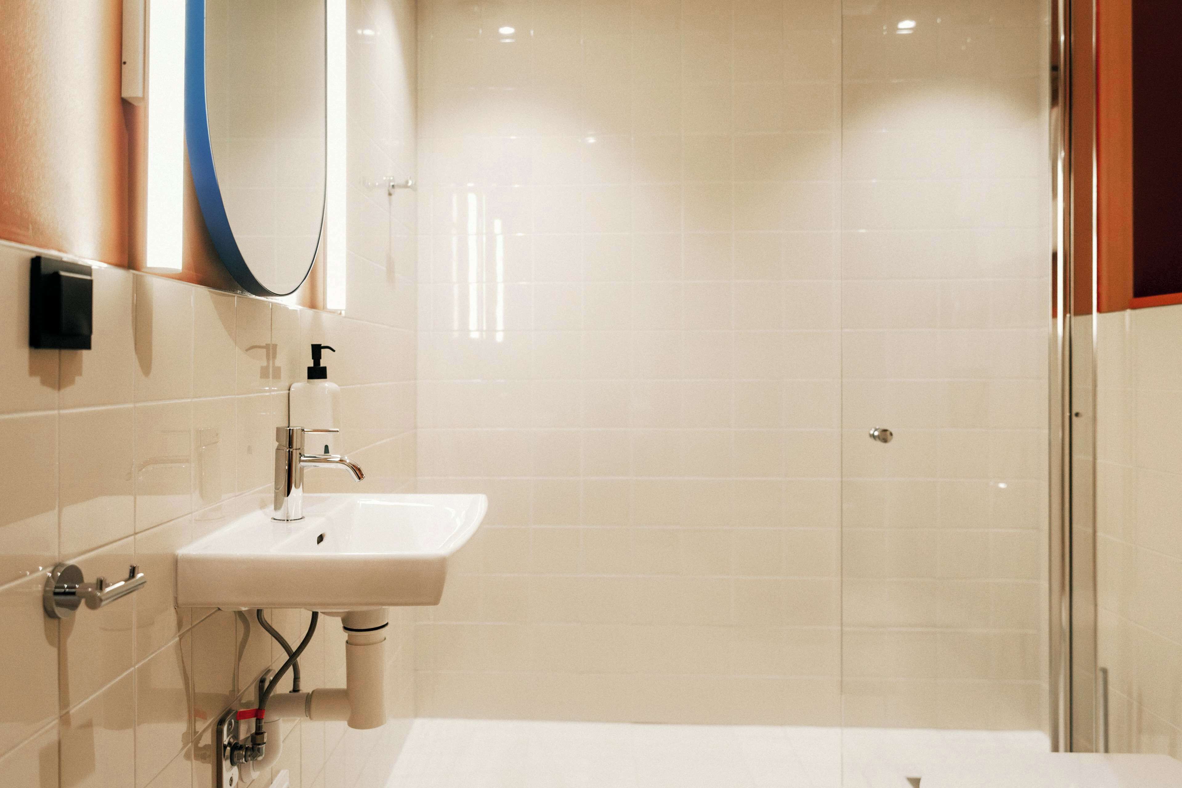 shower, rainfall showerhead, hair dryer, towels