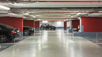 A multi-level parking garage with cars parked on different levels.
