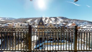 A snow-covered town with historic buildings and a view of a mountain range. - The Landmark (Vail)
