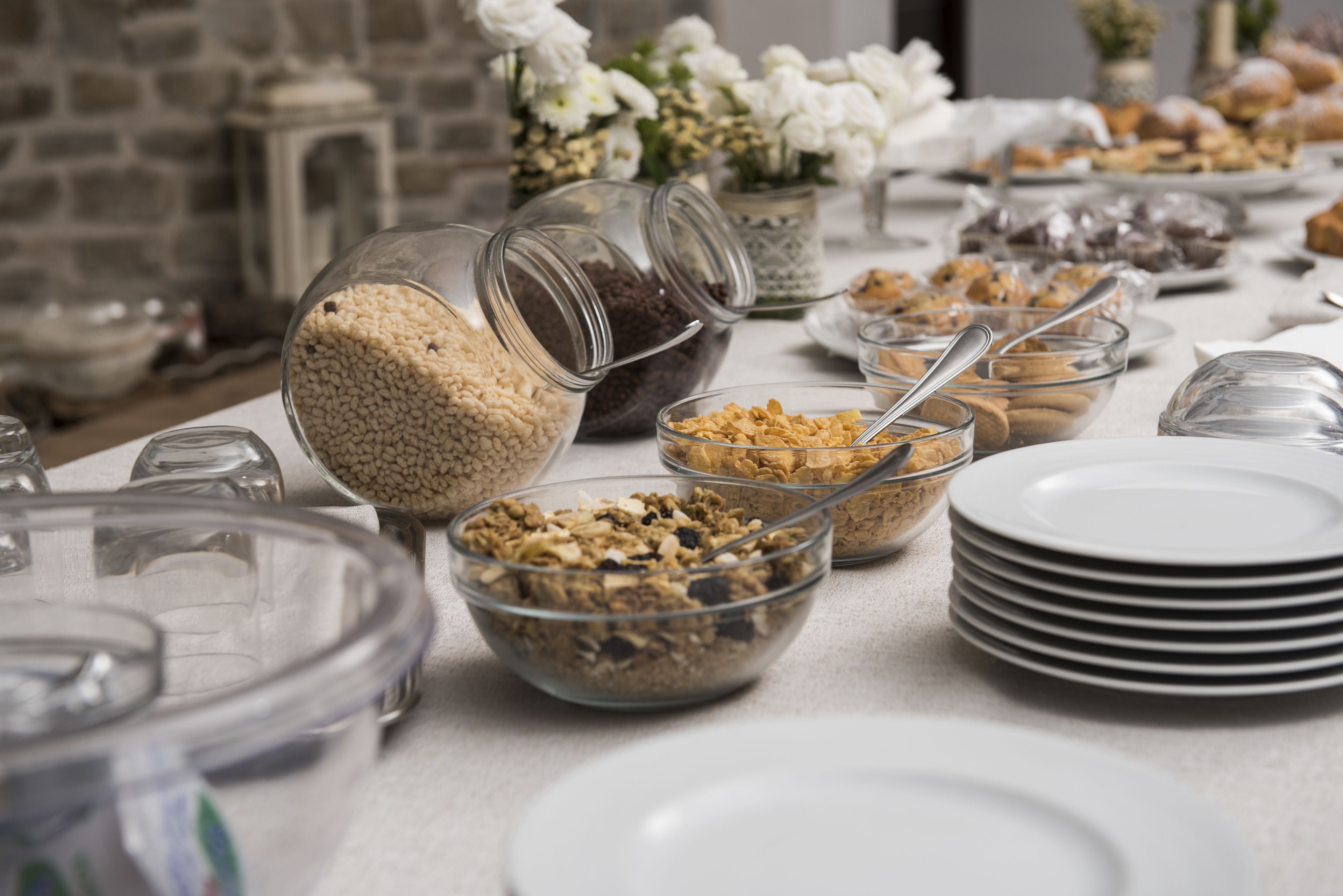 A buffet table with various food items and serving dishes.