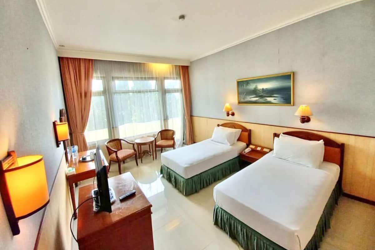 Luxe beddengoed, een kluis op de kamer, een bureau, gratis wifi