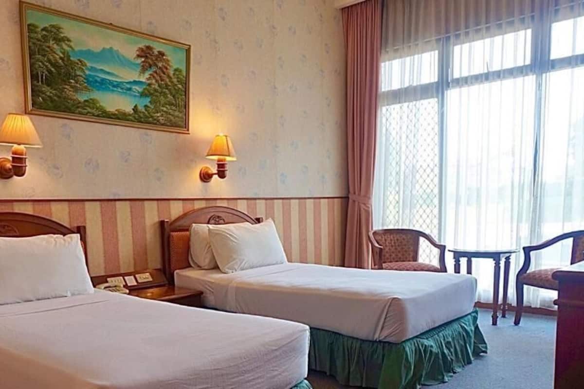 Luxe beddengoed, een kluis op de kamer, een bureau, gratis wifi