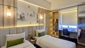 A hotel room with two beds, a desk, a chair, a wardrobe, and a painting on the wall. -  Ayda Mangga Dua d/h Zuri Express Mangga Dua (Jakarta)
